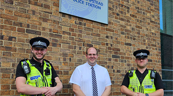 Mr Ash-Edwards with two officers