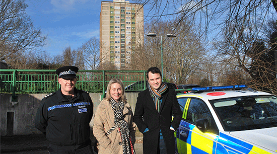 Deputy PCC, officer and council representative outside tower block