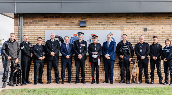 Officers and staff line up outside new dog unit